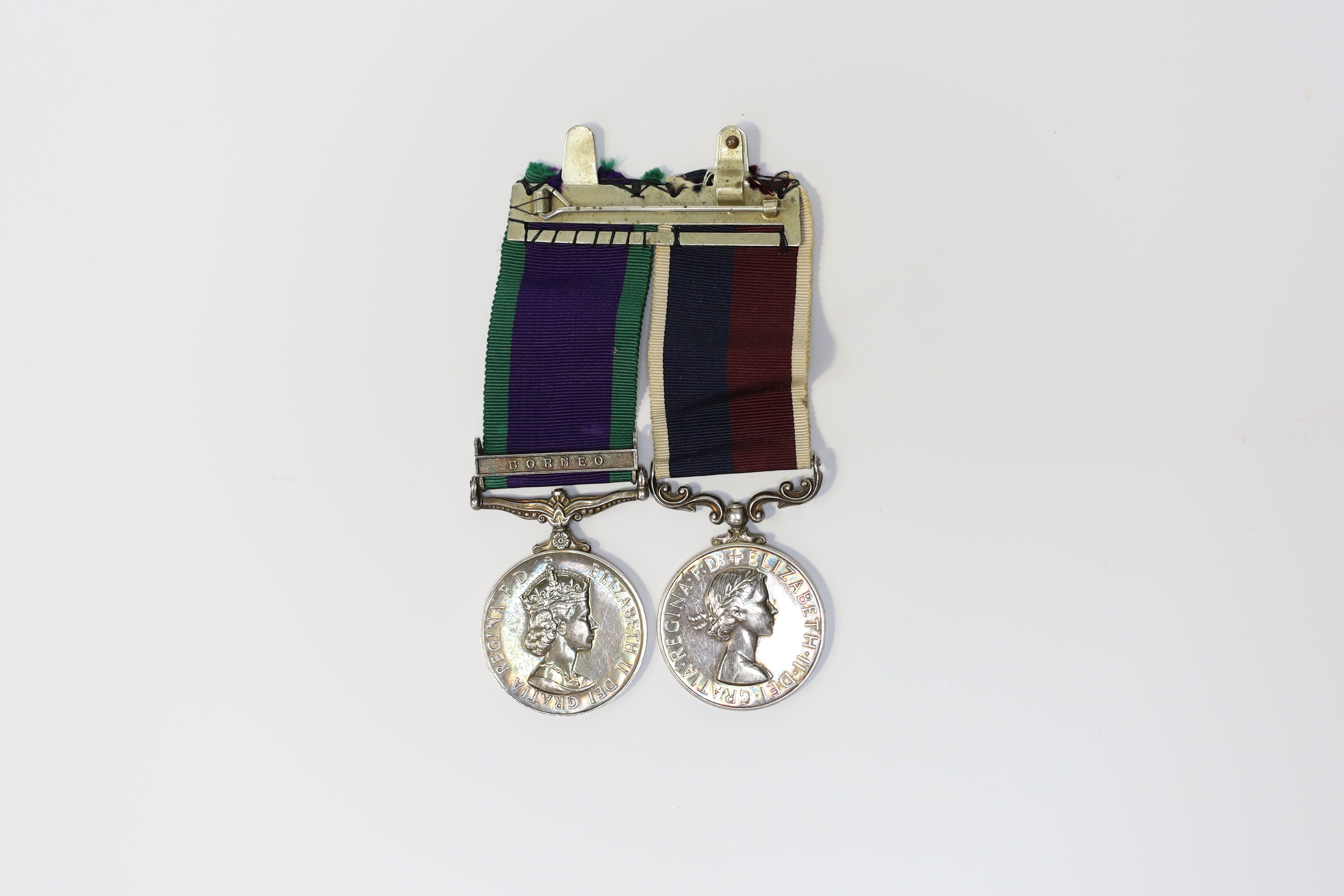 An ERII RAF medal pair awarded to Cpl. A.F.G. Pitcher RAF, comprising; a General Service Medal with a bar for Borneo and an RAF Long Service Medal, mounted on a common pin. Condition - fair to good